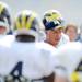 Michigan defensive coordinator Greg Mattison huddles with the defense on the practice field outside of the Al Glick Field House on Thursday, August 8, 2013. Melanie Maxwell | AnnArbor.com 